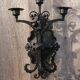 Pair of black wrought iron wall sconces - neo-Gothic style - from the 1950s