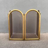 Antique brass fireplace screen from 1920, vintage spark guard.