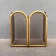 Antique brass fireplace screen from 1920, vintage spark guard.