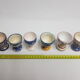 Lot of six enamelled ceramic cockroaches with Mediterranean themed decorations