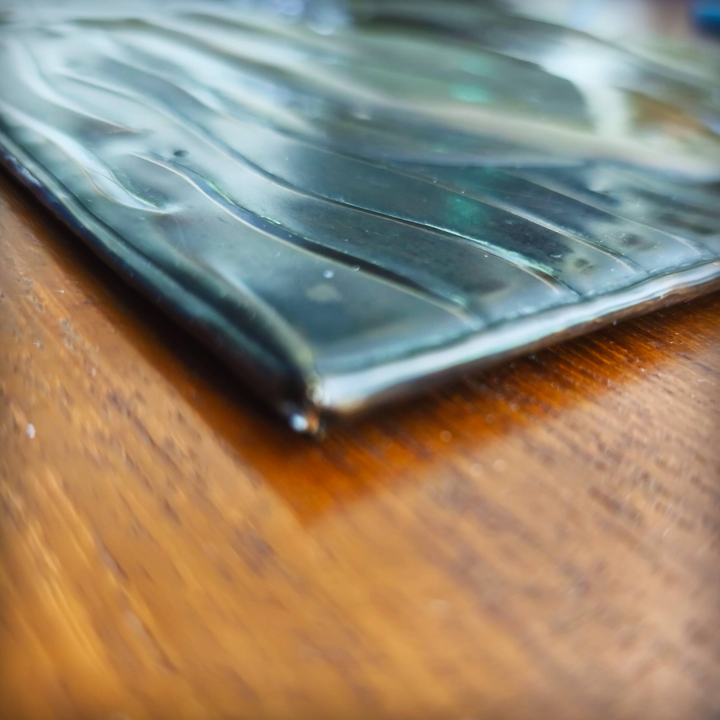 Brass table featuring a woman and a dolphin, France, 1960s.