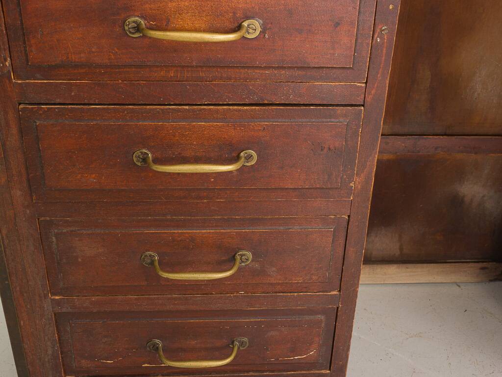 Small vintage stained wooden countertop with 2 shelves and 10 drawers