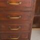 Small vintage stained wooden countertop with 2 shelves and 10 drawers