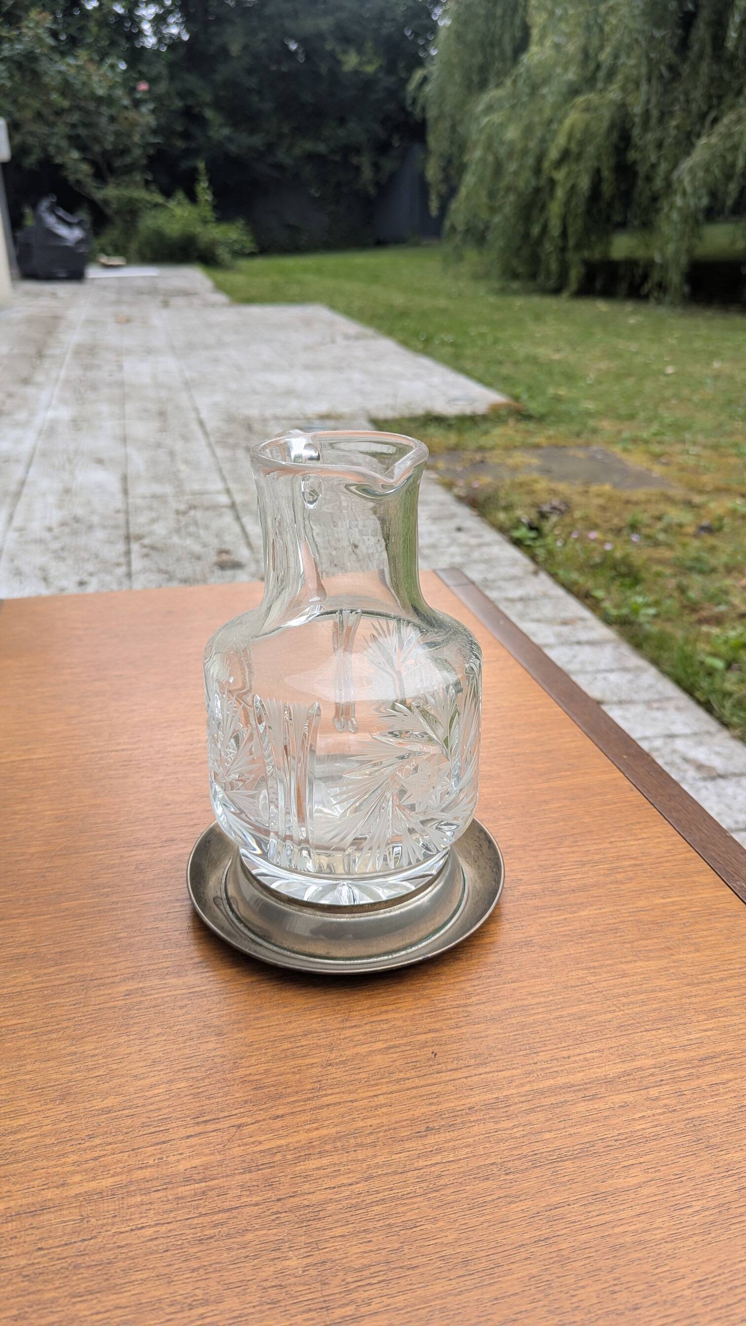 Jug / Carafe made of cut glass or crystal with its metal under-bottle.
