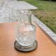 Jug / Carafe made of cut glass or crystal with its metal under-bottle.
