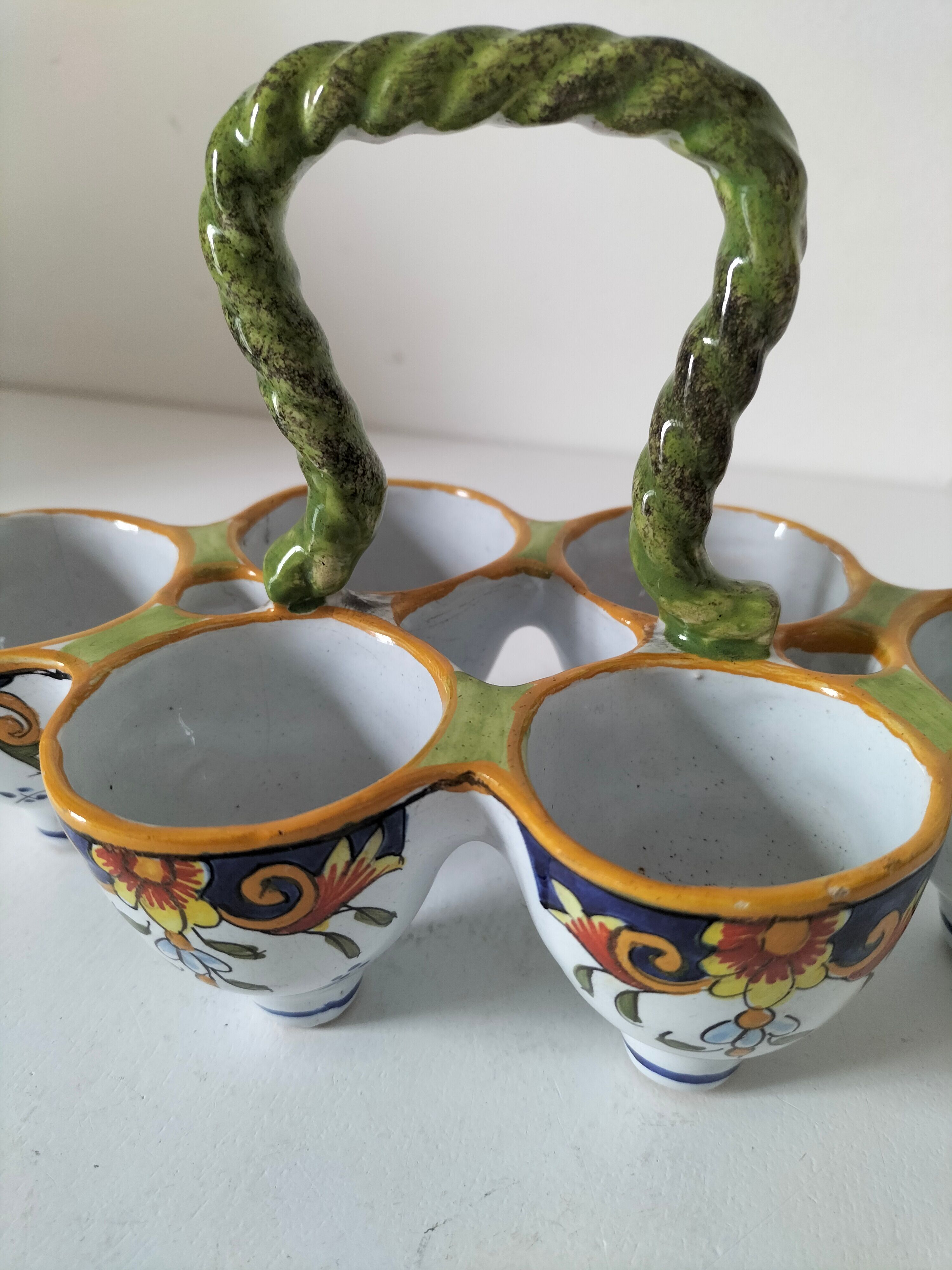 Antique egg holder by Jules Verlingue with polychrome floral decoration.
