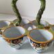 Antique egg holder by Jules Verlingue with polychrome floral decoration.