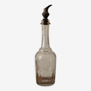 Chiseled glass rum bottle