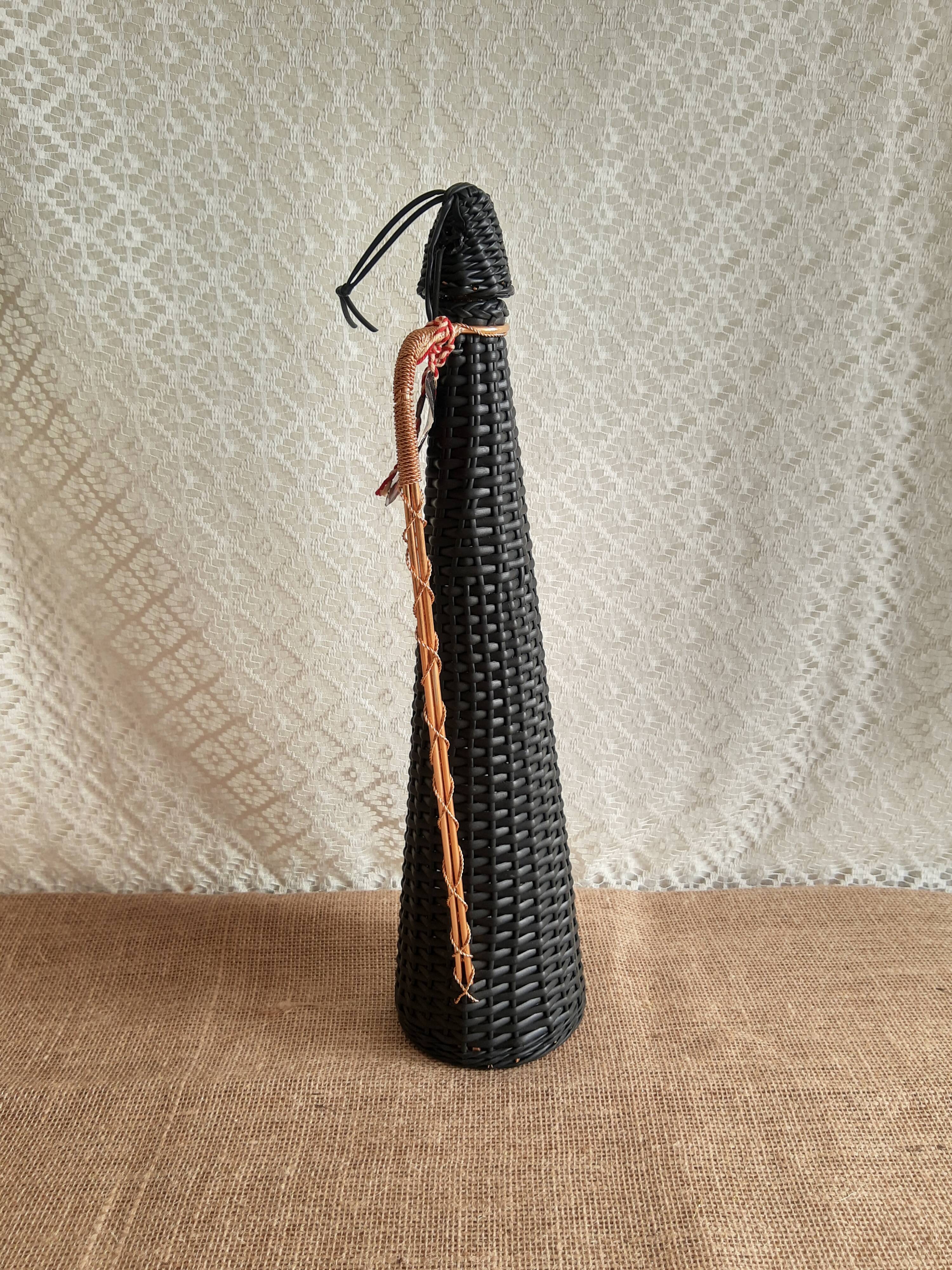 Glass bottle covered with black scoubidou with twisted golden handle - vintage