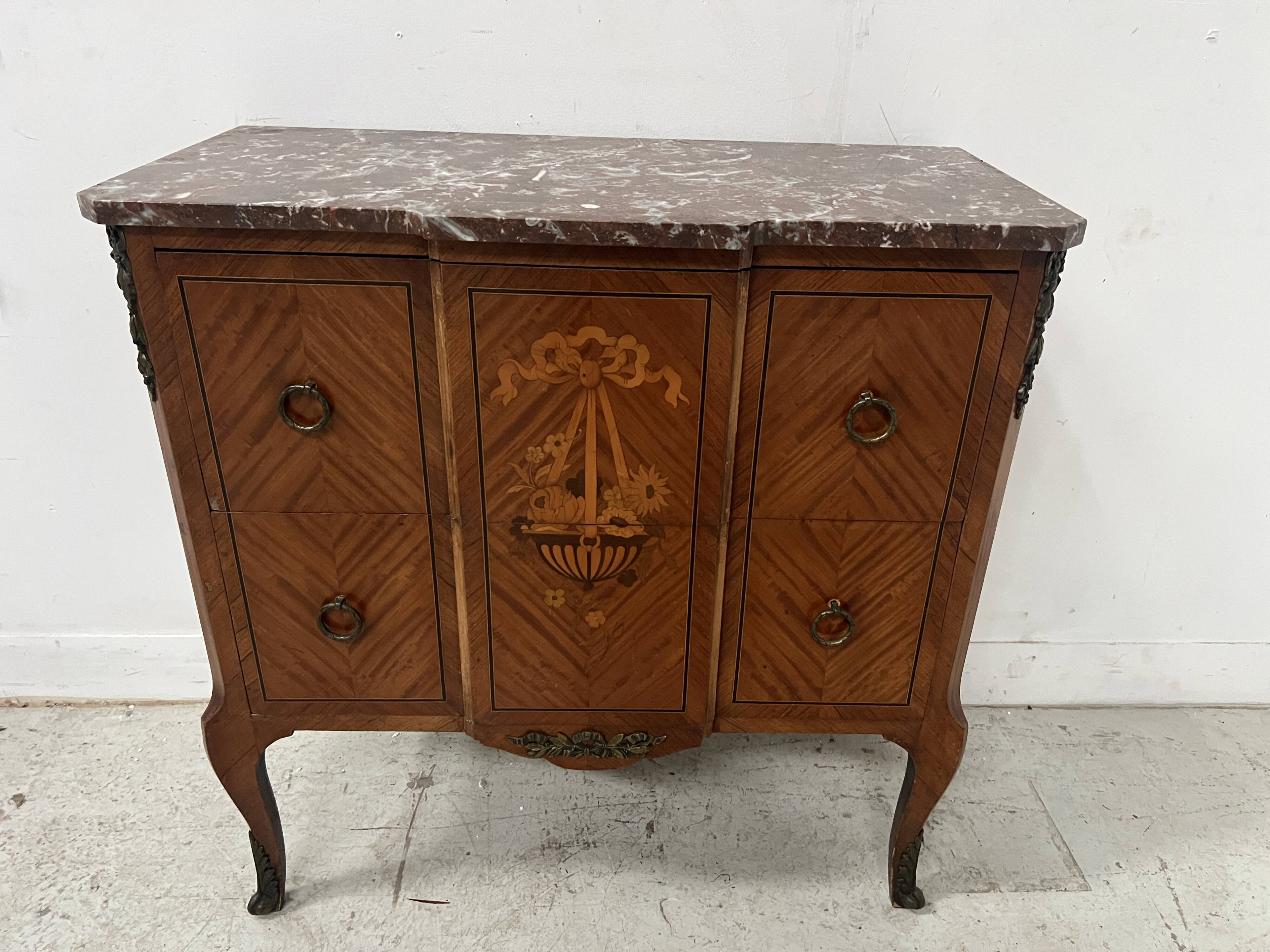 Transitional style commode with a protruding front, in marquetry wood, 20th century.