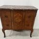Transitional style commode with a protruding front, in marquetry wood, 20th century.
