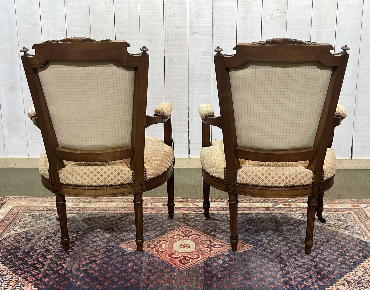 Pair of early 20th century Louis XVI armchairs in walnut