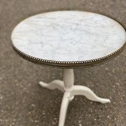 Pair of marble and ivory tripod pedestal tables