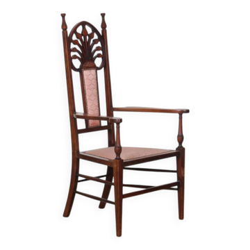 English armchair attributed to J.S. Henry, late 19th century.