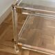 2 side tables in plexiglass, glass, and brass.