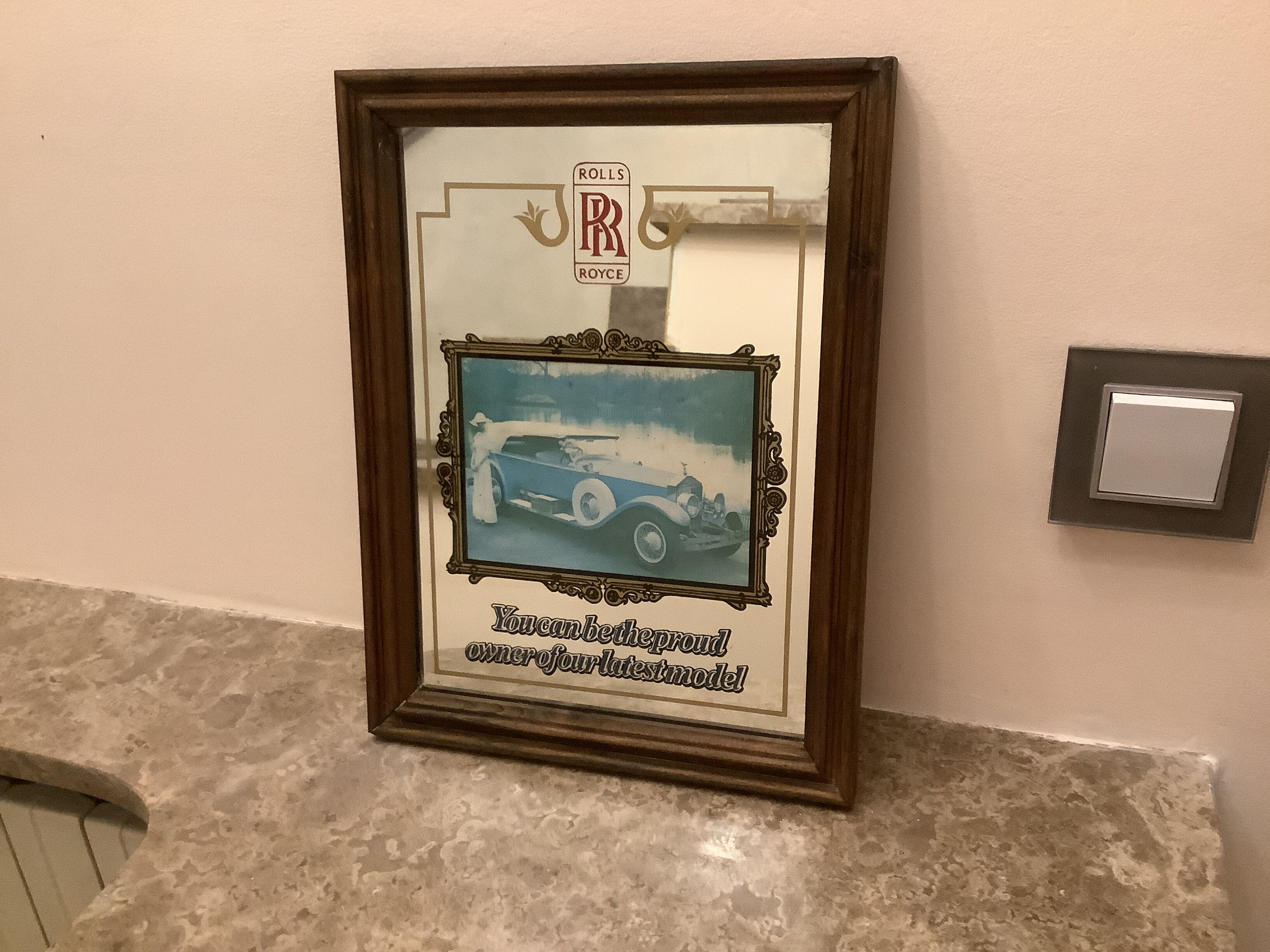 Mirror illustration of old Rolls Royce car
