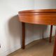 Extendable teak round table