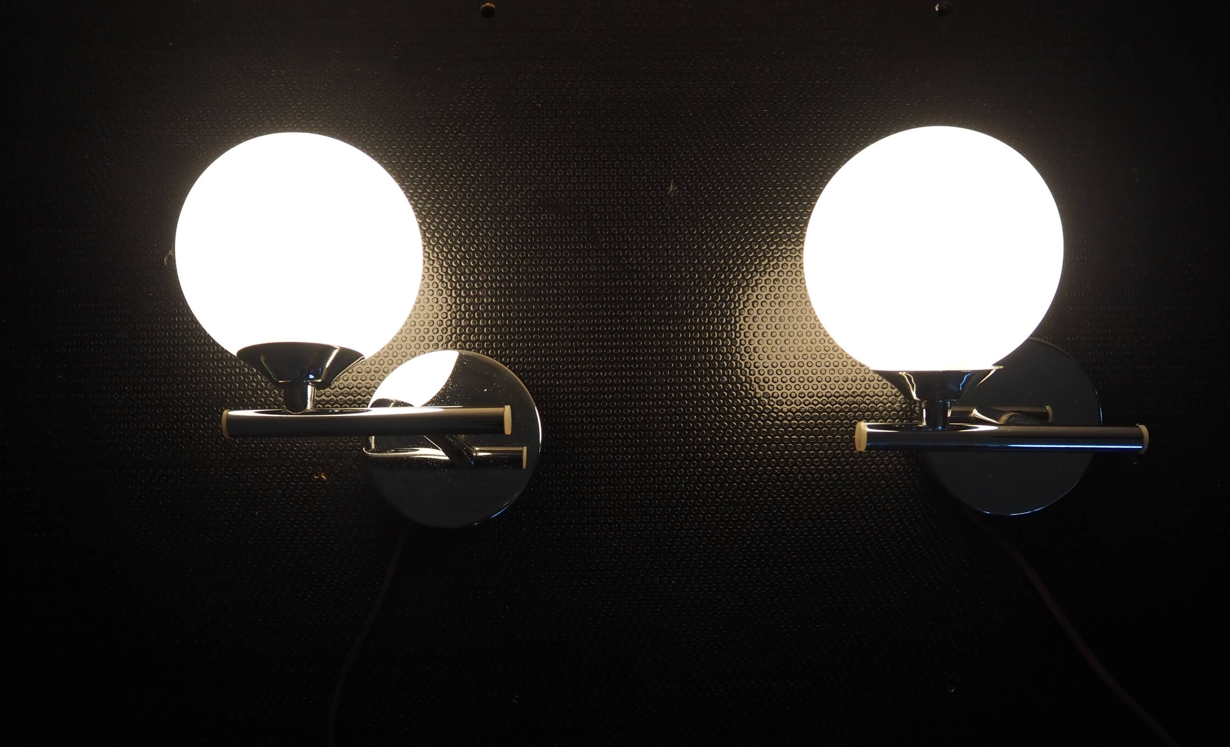 Pair of sconces with an opaline globe and chrome structure from the 1970s