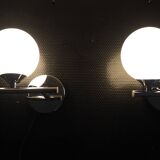 Pair of sconces with an opaline globe and chrome structure from the 1970s