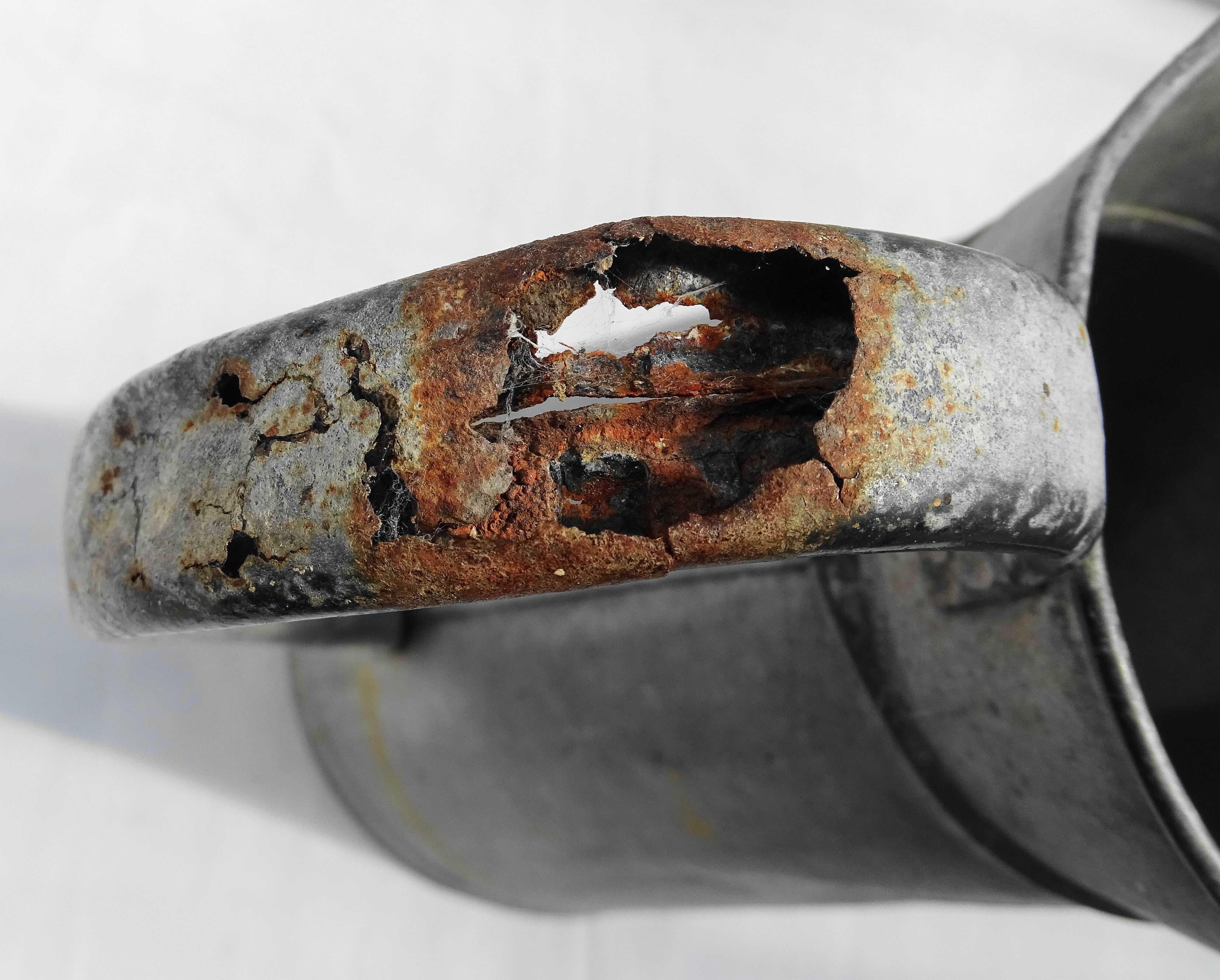 Old zinged metal broc