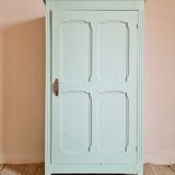 Parisian wardrobe small format soft green interior terracotta