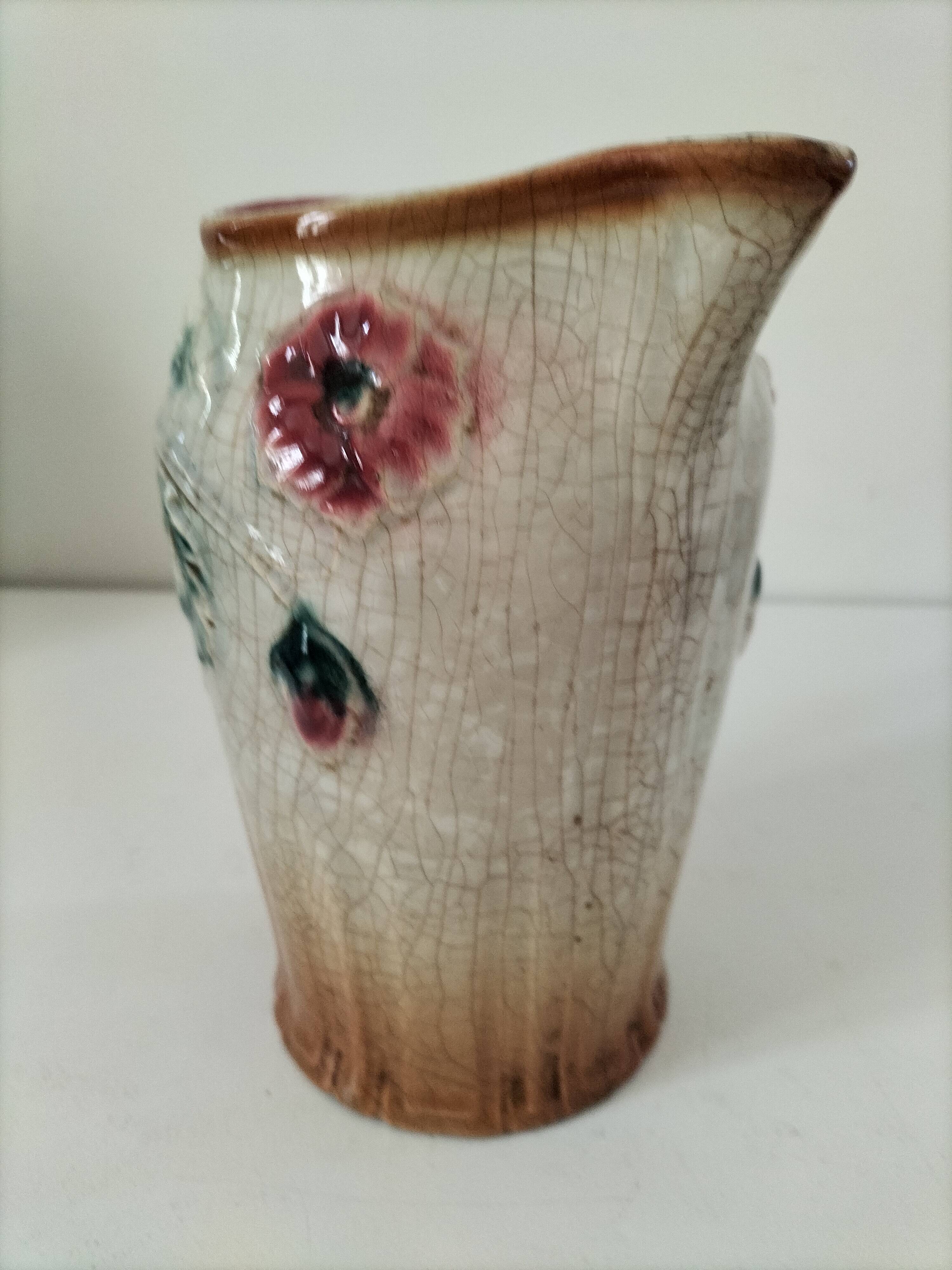 Moulded slip pitcher - late 19th century - Floral decoration in relief