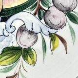 Decorative earthenware and pewter wall plate with fruits