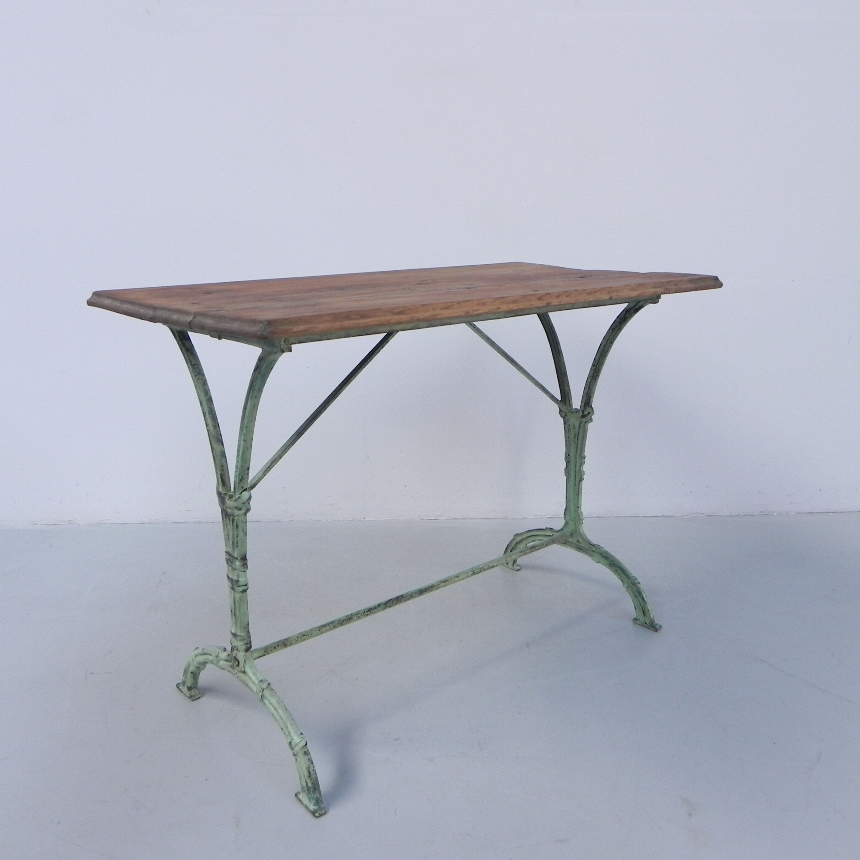 Art nouveau bistro table with cast iron frame