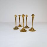 Mid-century set of 5 brass candlesticks by Lars Holmström, Arvika, Sweden.