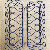 Pair of blue-painted wrought iron planters, 1960s