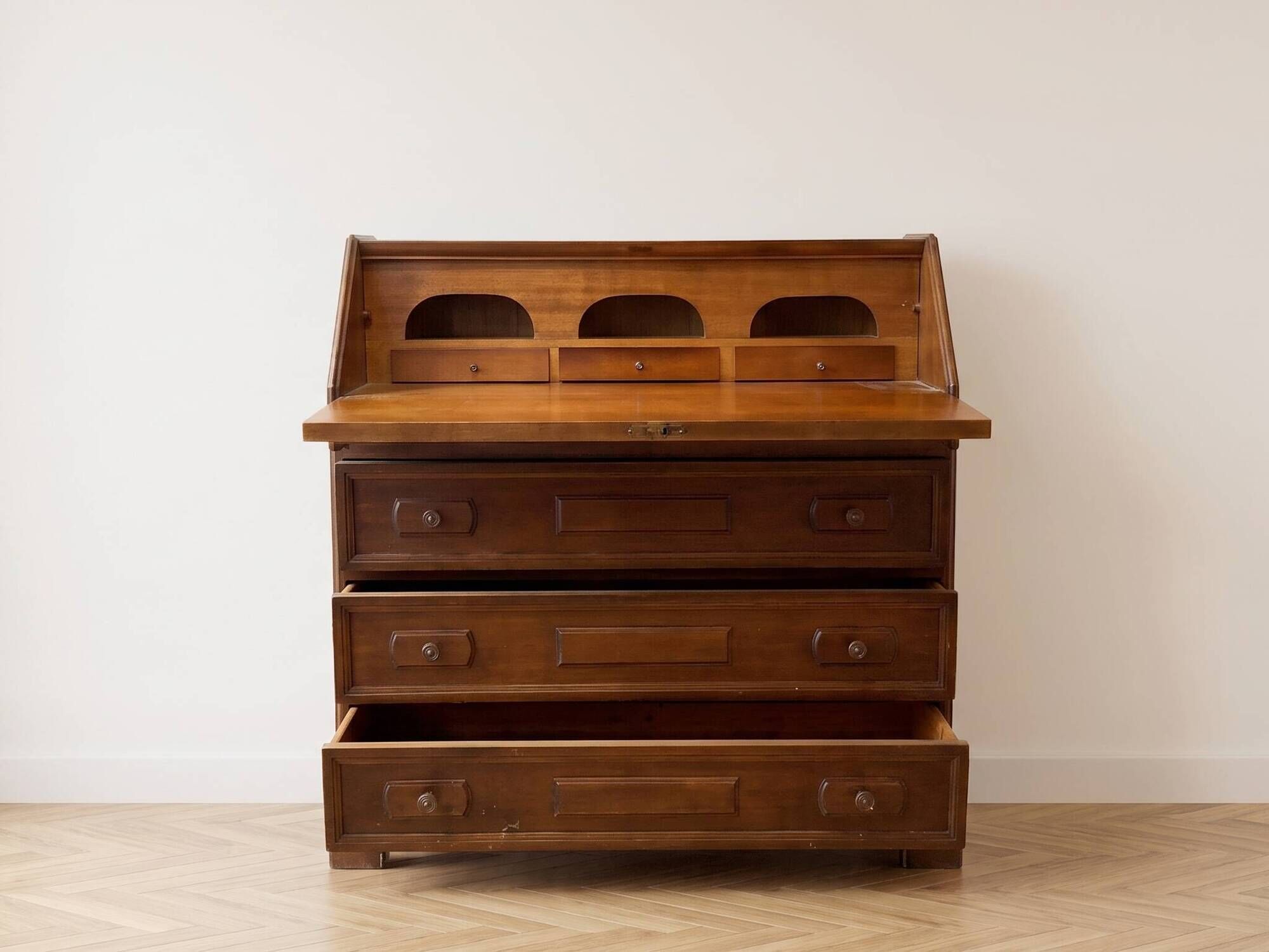 Antique wooden secretary with a drop-down front and drawers.