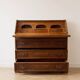 Antique wooden secretary with a drop-down front and drawers.
