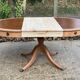 Round extendable table in Empire style, renovated with Bordeaux leather and raw wood, 168cm.