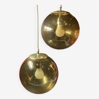 Pair of vintage smoked glass ball pendant lights from Biot glassworks