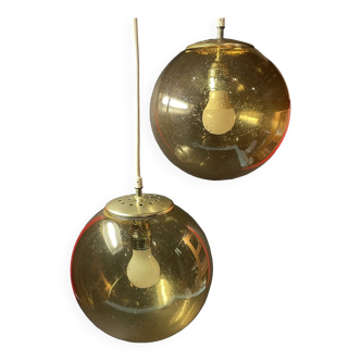 Pair of vintage smoked glass ball pendant lights from Biot glassworks