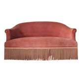 Banquette crapaud en velours rose avec franges
