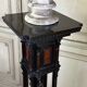 A pedestal table in blackened wood and burl veneer, superb assembly of moldings circa 1880