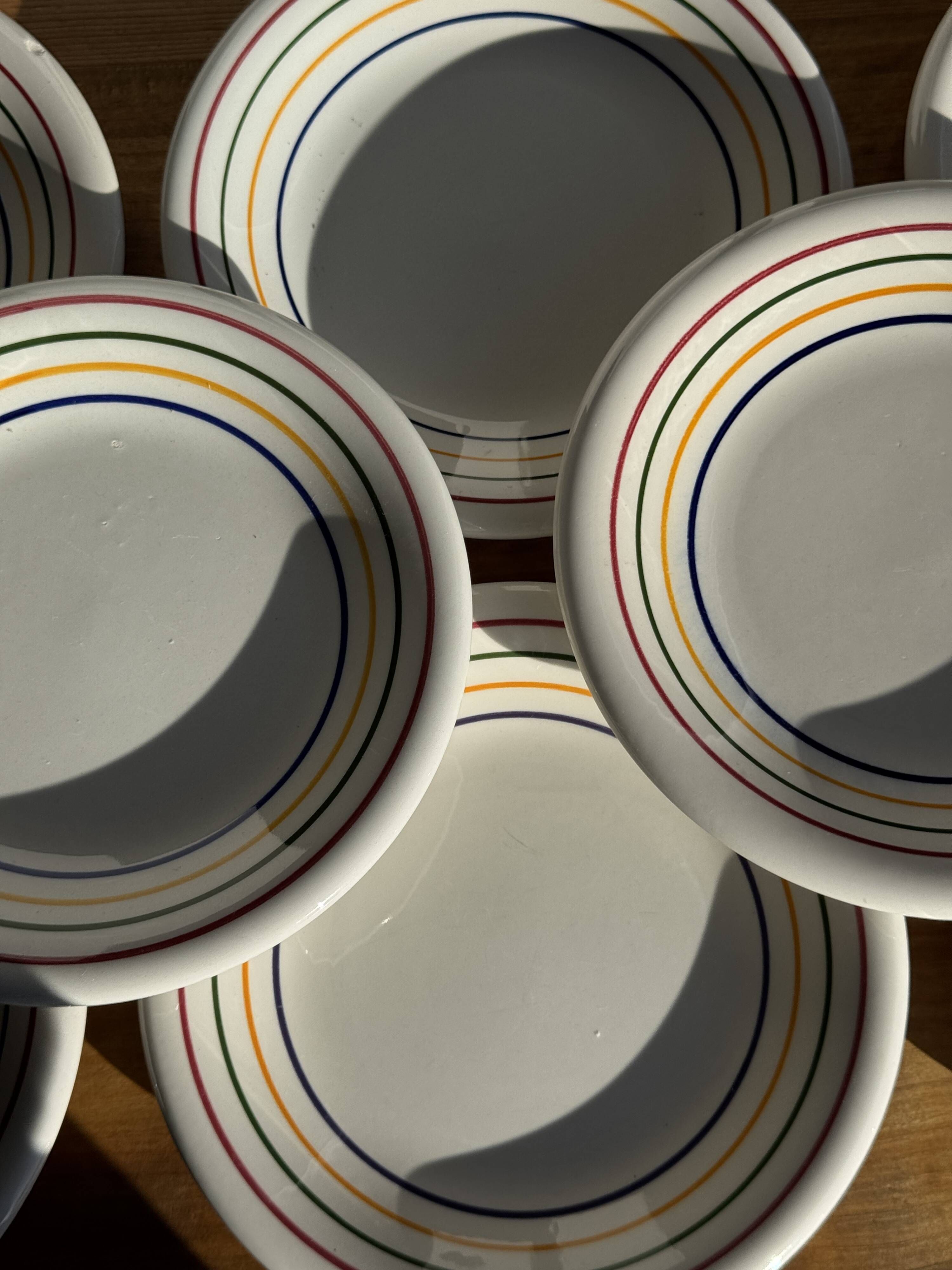 Set of 9 small Italian dessert plates Primula with red and green trim.