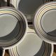 Set of 9 small Italian dessert plates Primula with red and green trim.