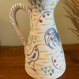 Pitcher with naive bird decor