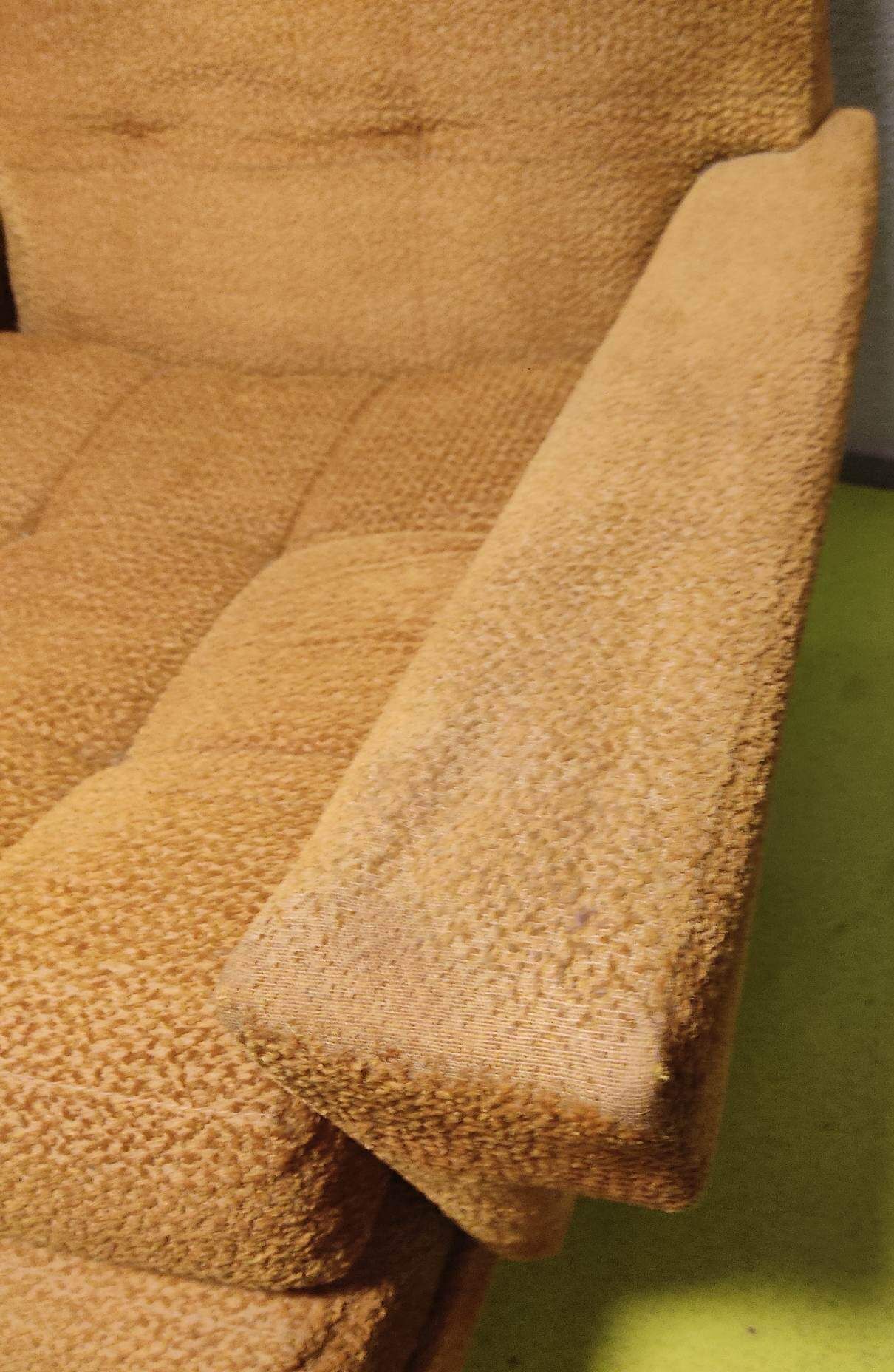 Old velvet heating chair on metal legs
