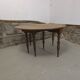 Half-moon extendable oak table for 2 to 8 people.