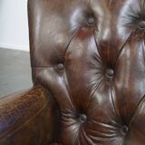 Cognac colored brown grained cowhide chesterfield armchair