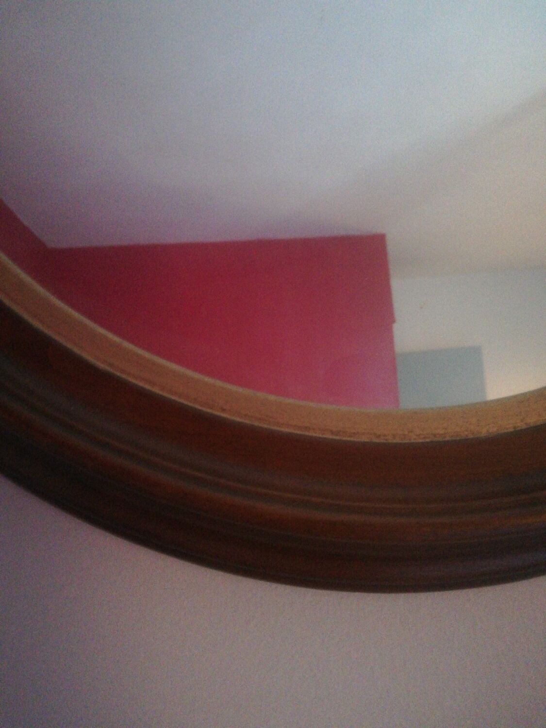 Oval mirror in wood and gold