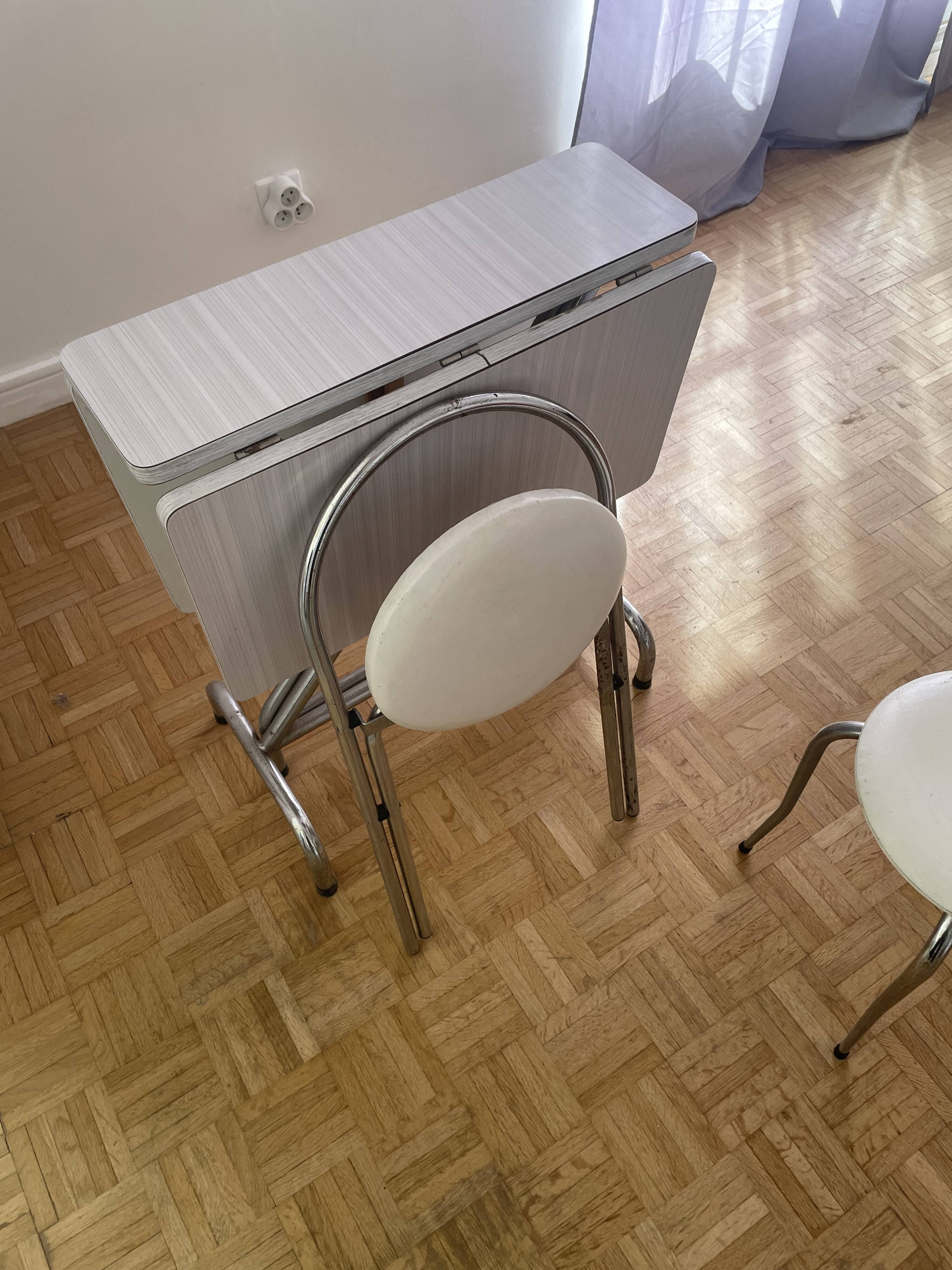 Small stools in metal and faux leather.