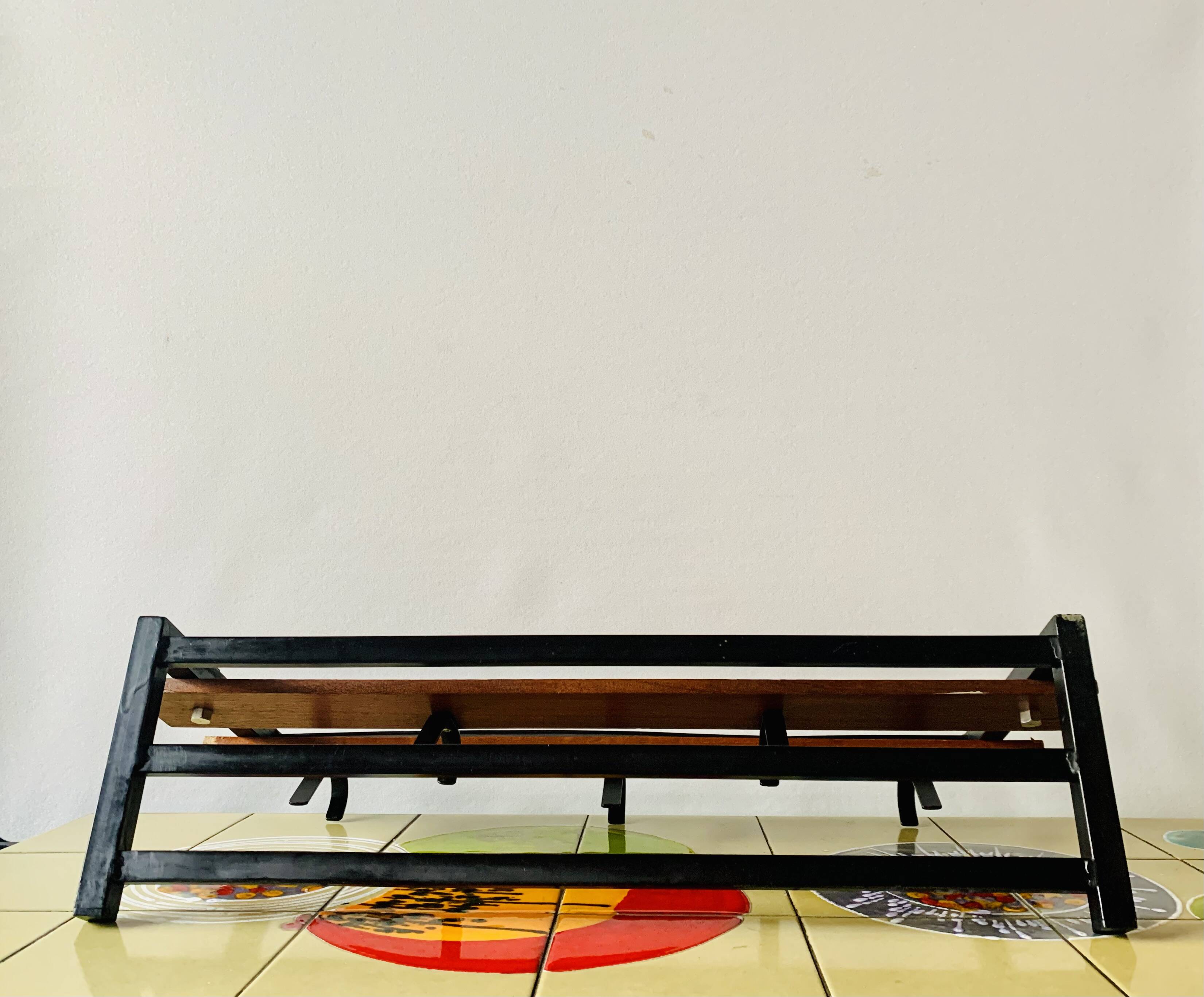 Vintage wall-mounted coat rack in wood and black metal