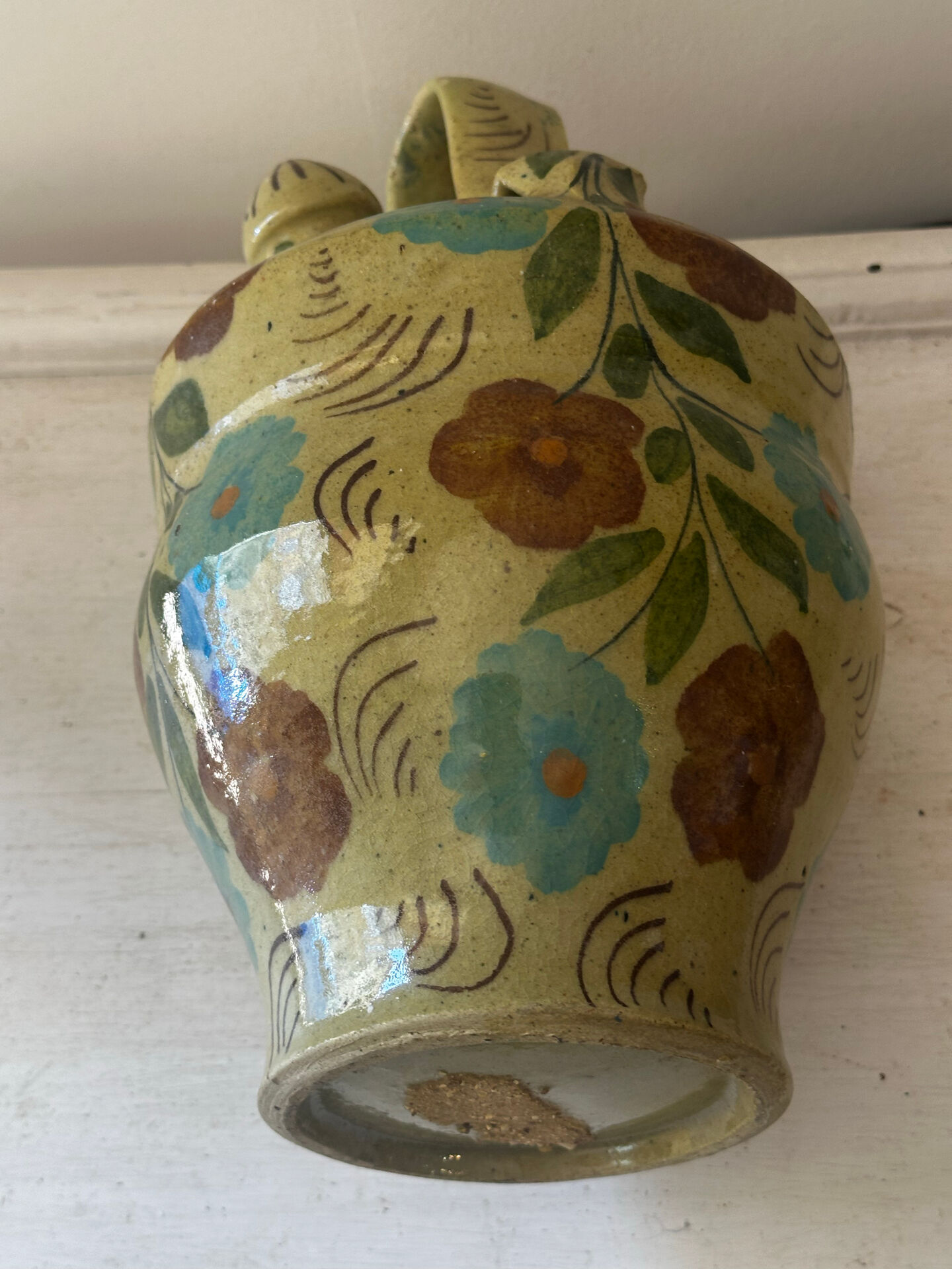 Mediterranean ceramic jug with floral decoration.