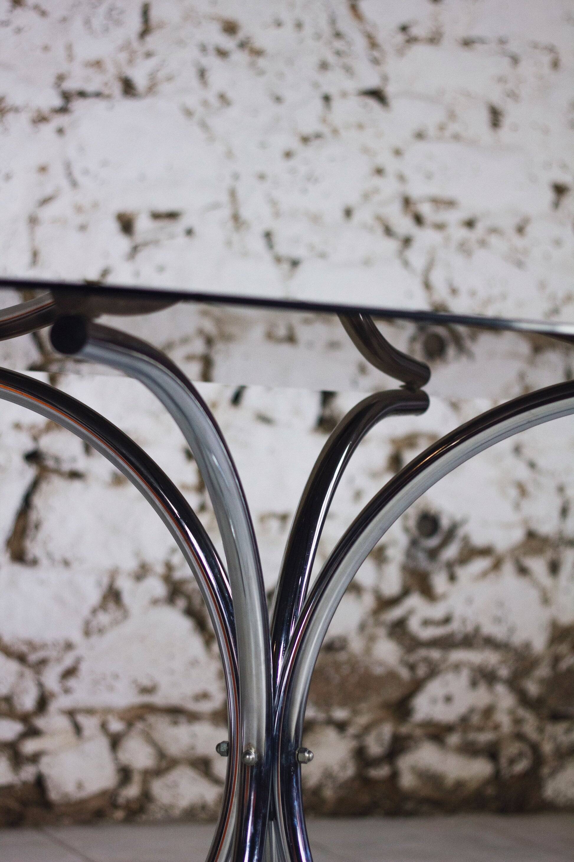 Oval dining table in chrome and smoked glass, 1970.