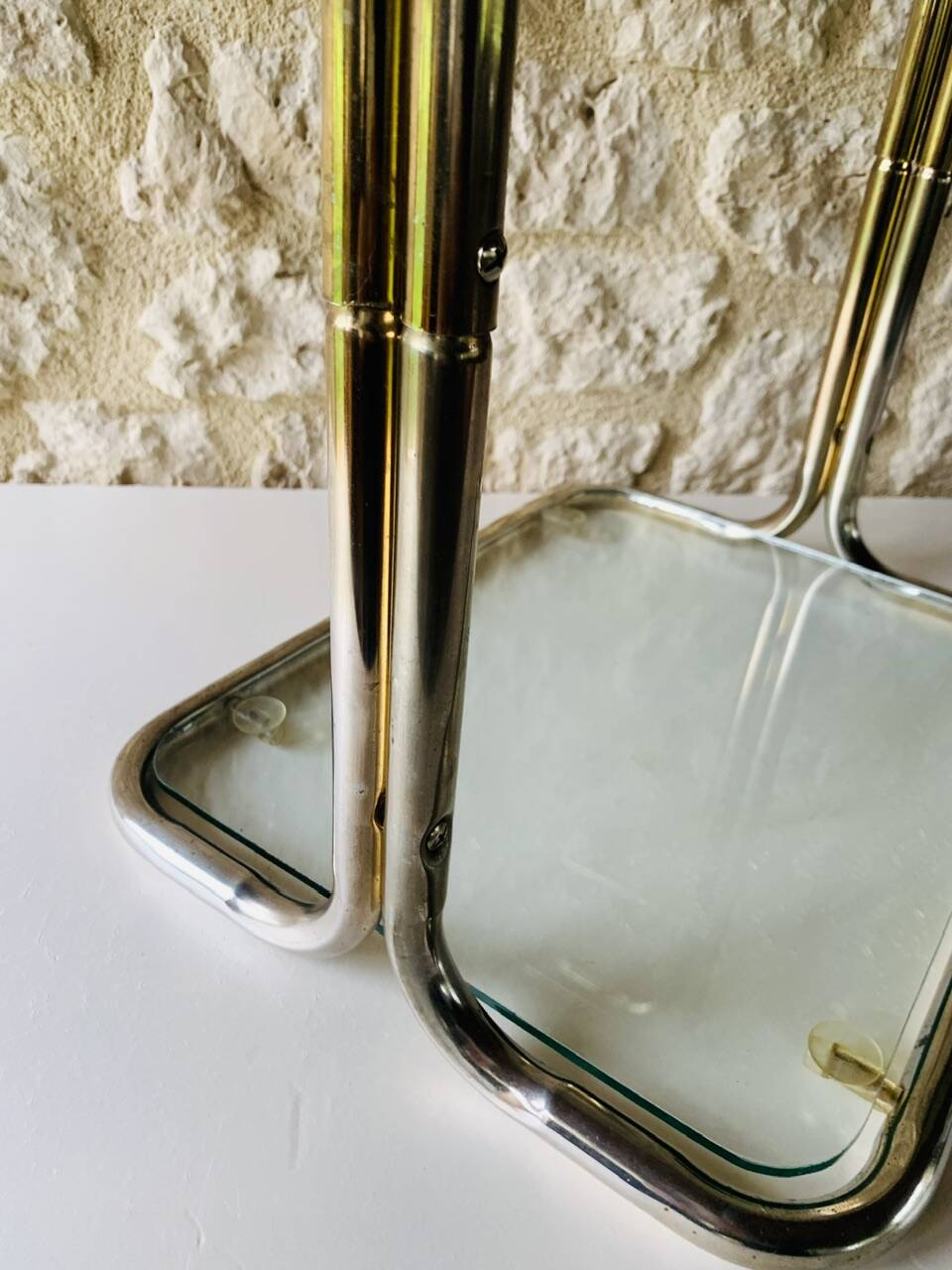 Glass and brass side table with magazine rack, circa 1970's