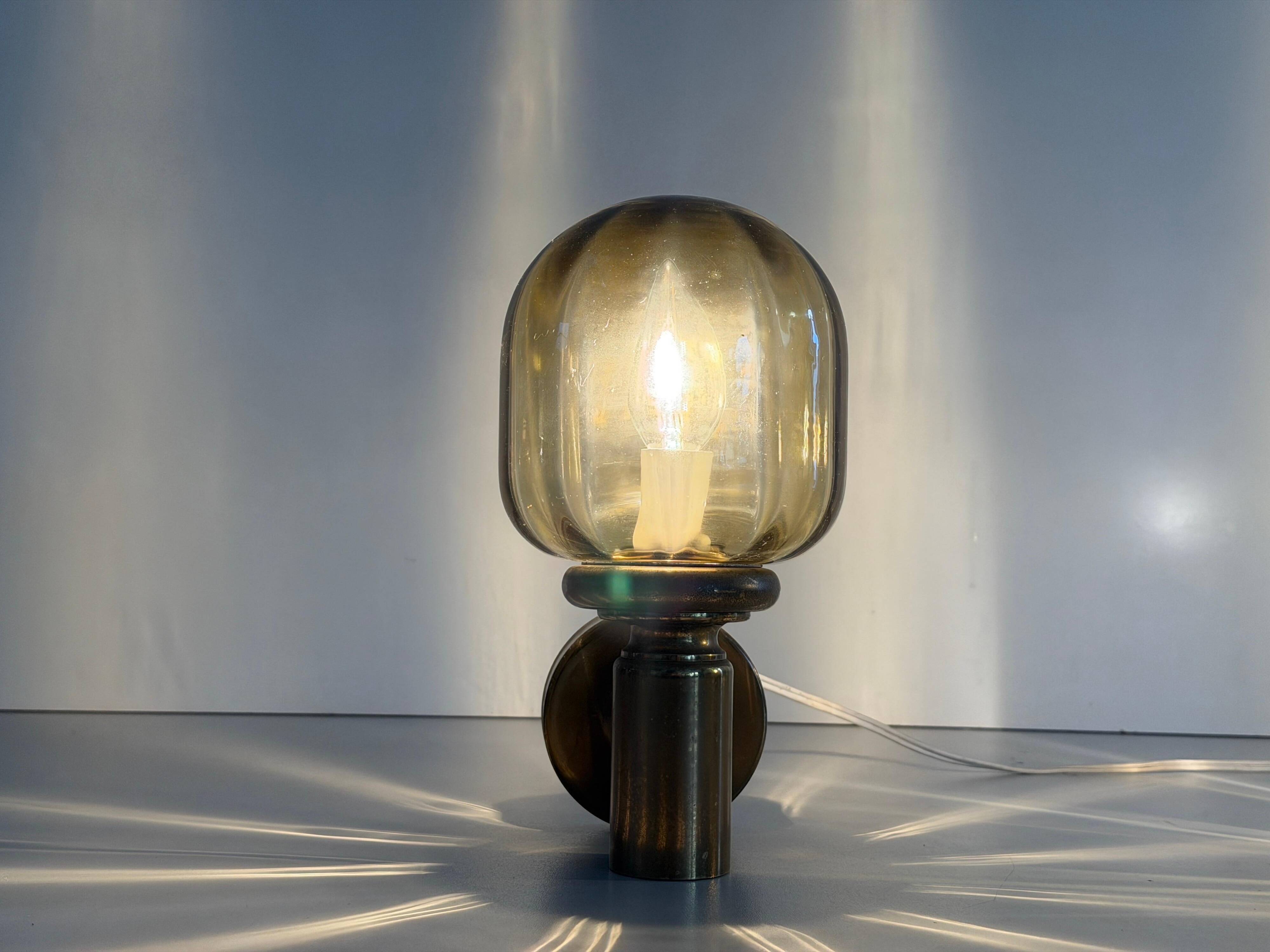 Pair of yellow glass and brass wall lights from the mid-century by N Leuchten, 1960s, Germany.